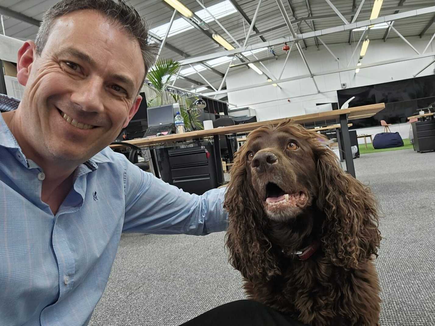 Paul Robson with office dog, Oakley